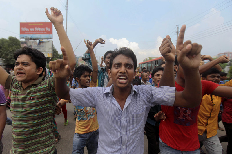 Bangladeshi garment workers protest in Dhaka on Monday. The workers are demanding $100 instead of the current monthly minimum wage of $38, which is the lowest in the world. Bangladesh is the world’s second-largest garment manufacturing country after China.
