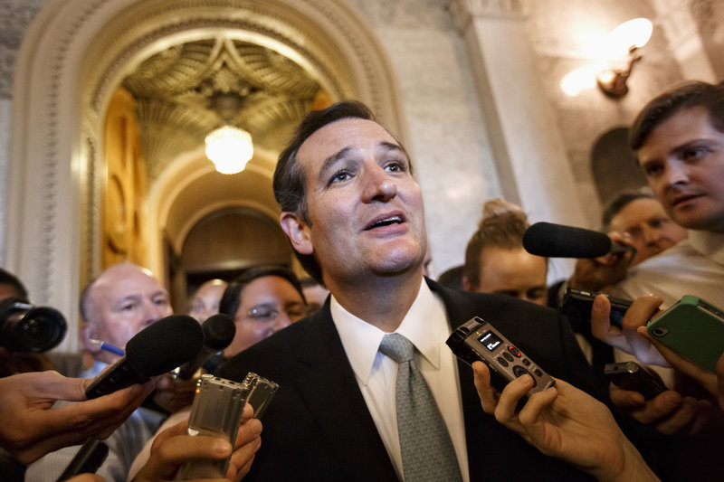 Sen. Ted Cruz, R-Texas, talks to reporters as he emerges from the Senate Chamber on Capitol Hill in Washington on Wednesday, after railing all night against the Affordable Care Act. A number of Republicans expressed disagreement with the senator’s tactics.