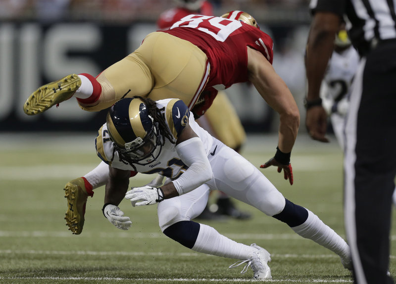 Tight end Vance McDonald of the San Francisco 49ers is upended by cornerback Janoris Jenkins of the St. Louis Rams after making a catch Thursday night in the second quarter of the 49ers’ 35-11 victory.