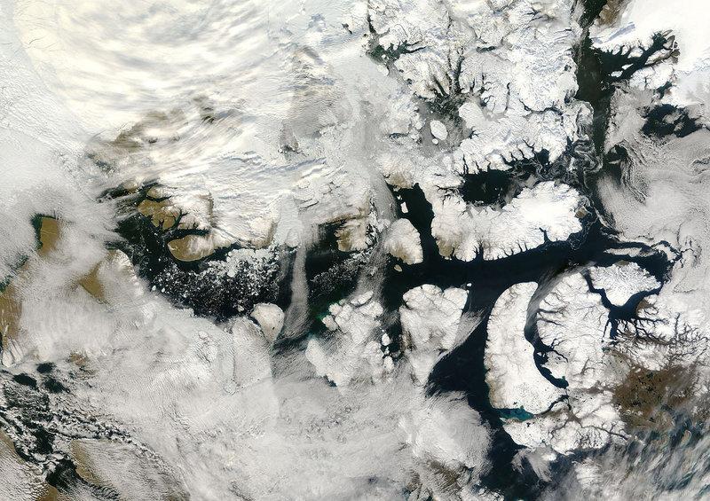 An ice-free Northwest Passage is seen in this September 2007 satellite photo from NASA. Interest in the passage is heating up as the ice that once made it impenetrable melts. An expert calls the rapid advance of global warming unsettling, even as he notes that it is opening up a new frontier.