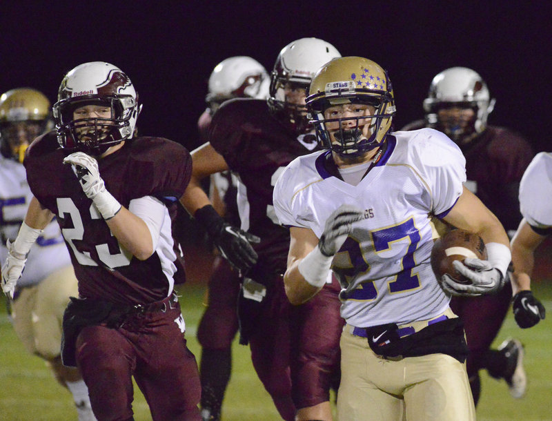 It was a familiar sight Friday night, Joe Fitzpatrick running with the ball for Cheverus and the Windham defense in pursuit. Fitzpatrick totaled 243 yards on 25 carries as the Stags pulled away to a 57-22 victory in a game between undefeated Eastern Class A teams.