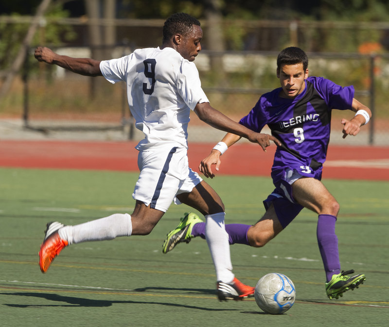 Yusef Yama of Portland brings the ball up the field Saturday as Ahmed Adnan of Deering applies pressure during their SMAA boys’ soccer game at Fitzpatrick Stadium. Both teams are 6-1-1 after Portland’s 2-0 victory.