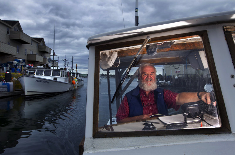 Casco Bay keeper Joe Payne pilots his boat off Portland. He received a new 28-foot boat this month in honor of his 22 years of work protecting the bay.