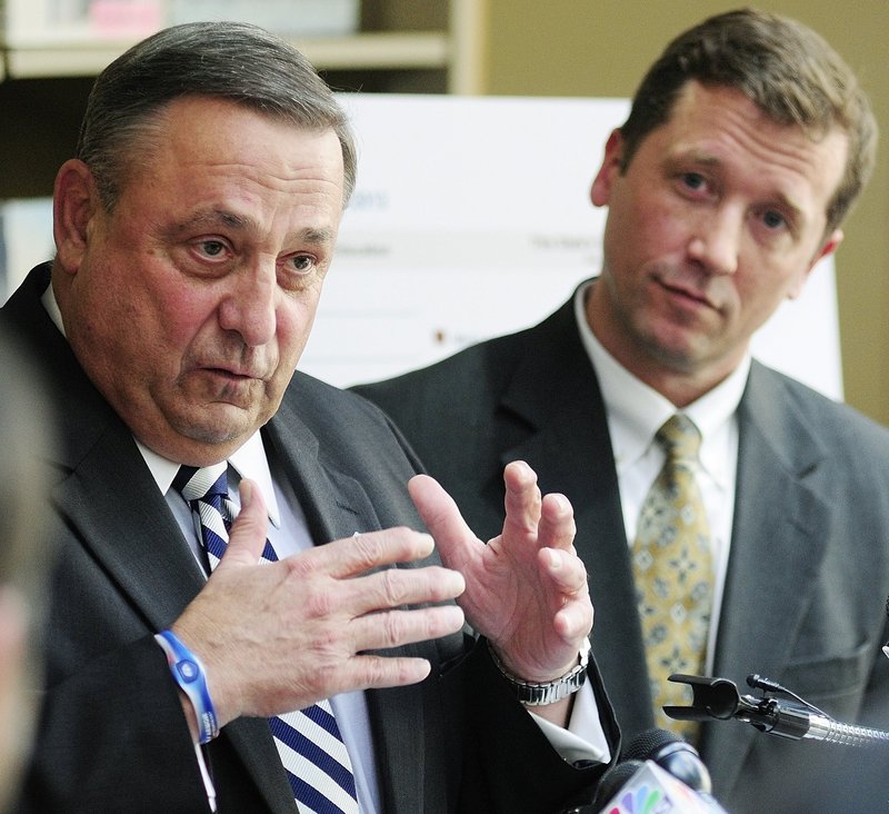 Then-Education Commissioner Stephen Bowen listens in May as he and Gov. Paul LePage unveil the state’s new A-F grading system for schools at the Maine State Library.