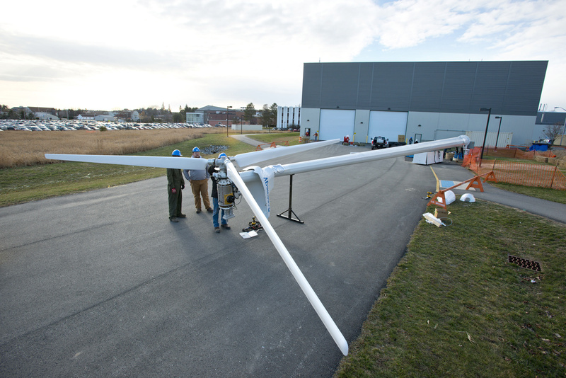 A team from the University of Maine at Orono tests a turbine outside their laboratory as they prepare to place the floating turbine in the ocean off the coast of Castine in May.