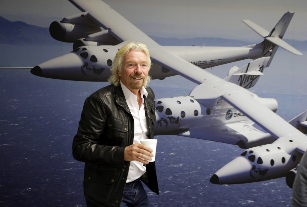 Entrepreneur Richard Branson stands in the Virgin Galactic hangar at Mojave Air and Space Port in California. He’s teaming with TV producer Mark Burnett on “Space Race.”