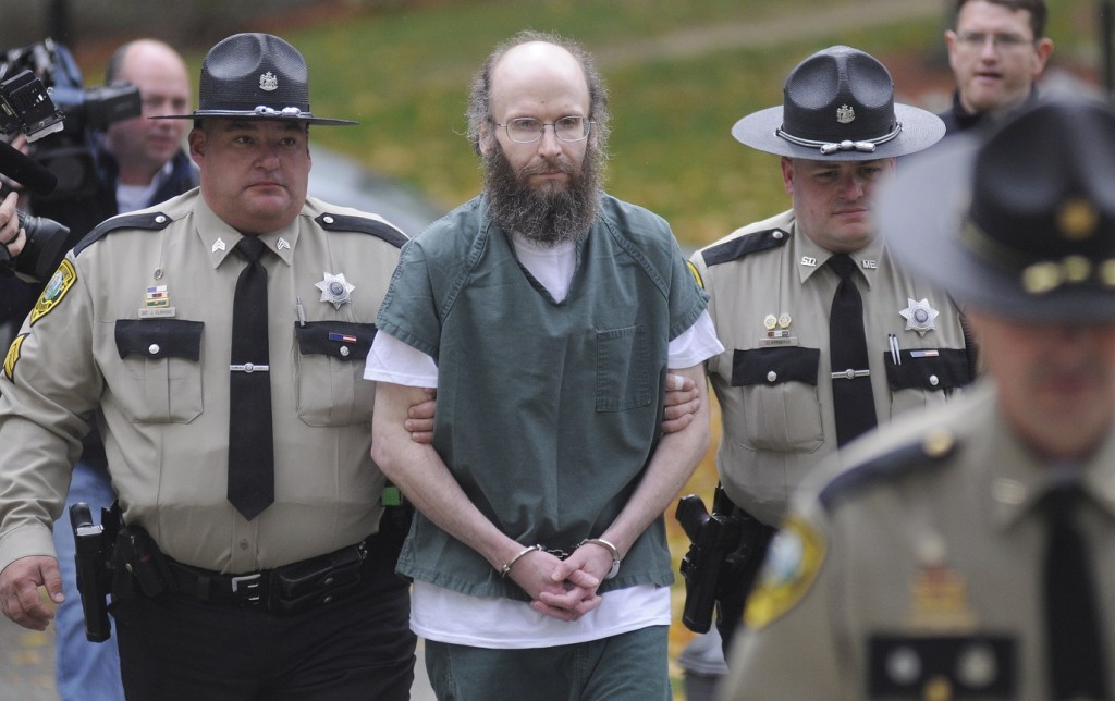 Christopher T. Knight is escorted Monday into Kennebec County Superior Court in Augusta, where he pleaded guilty to multiple burglaries and thefts committed during the 27 years he spent living in the woods. Knight was admitted into the Co-Occurring Disorders Court, a special, intensive supervision program allowing him to live and work in the community while reporting weekly to a judge.