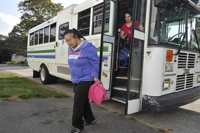 Sheena Patel, 27, is dropped off at her South Portland home by an RTP bus after her day at “Affinity,” an outpatient rehabilitation facility in Portland.