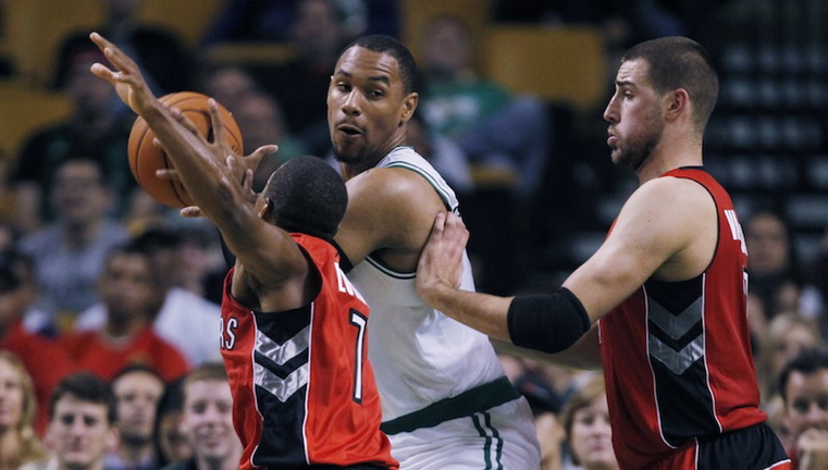 In this file photo, Boston Celtics power forward Jared Sullinger, center, looks to pass against the Toronto Raptors during a preseason NBA basketball game, Monday, Oct. 7, 2013. A judge on Monday, Oct. 28 dismissed domestic violence charges against Boston Celtics forward Jared Sullinger after his girlfriend said she would refuse to testify against him.