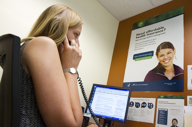 Carl D. Walsh/Staff Photographer With the health insurance marketplace open for business, Outreach Specialist Libby Cummings, at Portland Community Health Center, answers questions on the phone about the new system on Tuesday, October 1, 2013.