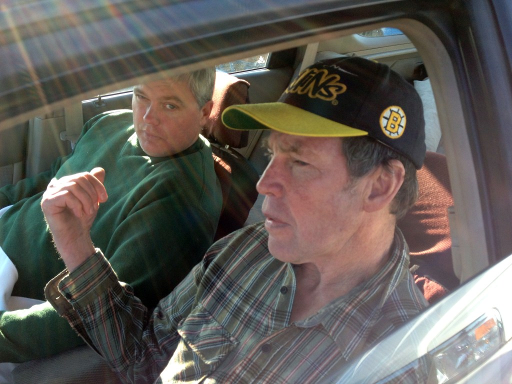 Fred Schaeffer, left, of Raymond, N.H., and George Reynolds, right, of Derry, N.H. sit in a car after being rescued in waters off of Salem, Mass. The two New Hampshire men whose boat capsized off the Massachusetts coast prayed and sang gospel songs as they survived a 15-hour ordeal that ended with them being rescued by a passing fishing boat. The men spent Friday night sitting on a plank over two hulls of a 25-foot trimaran as waves crashed over them through the night.