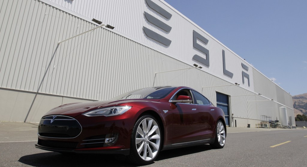 A Tesla Model S sits outside the Tesla factory in Fremont, Calif. Shares of Tesla Motors are down as investors in the high-flying company assess the fallout from a fire in one of its $70,000 electric cars.