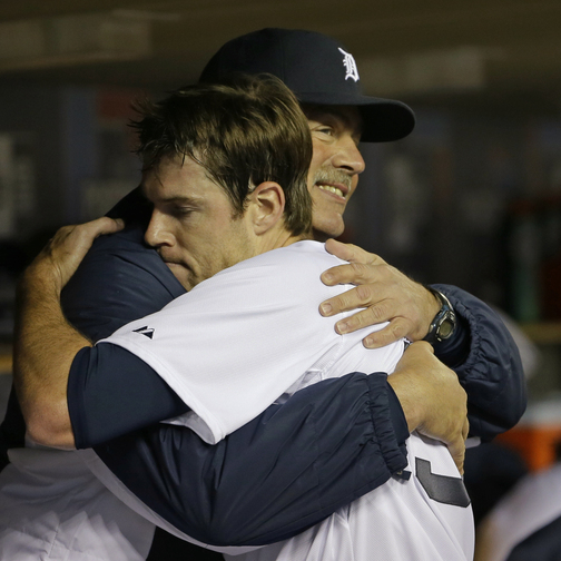 Detroit Tigers starting pitcher Doug Fister hugs pitching coach Jeff Jones after the sixth inning of Game 4 on Wednesday night. Fister was the winner in the 7-3 victory.