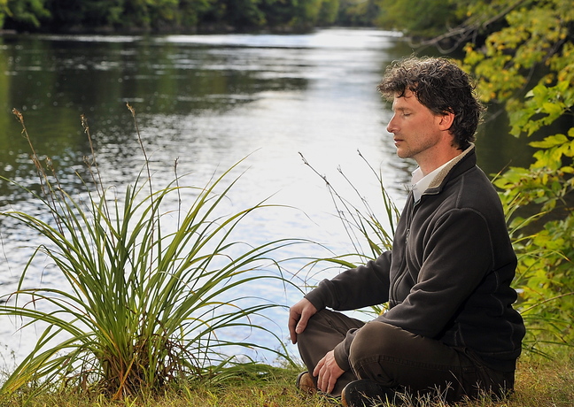 Kevin Emmons of Hollis, a druid, meditates. Modern druids believe in the divinity of nature.