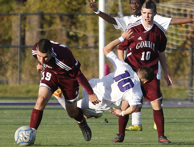 Matt Hooker of Gorham left, collides with Frankie Alvarez of Deering during the first half of their Western Class A boys’ soccer quarterfinal Wednesday. Gorham used a second-half goal to come away with a 1-0 victory on the road.