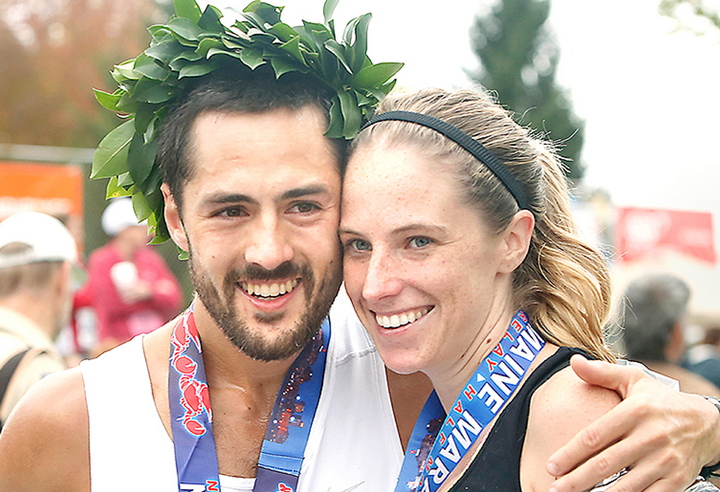 Rob Gomez of Saco receives a hug from his girlfriend, Breagh MacAulay, after winning the Maine Marathon Sunday in a time of 2:24:21 in Portland on Sunday.