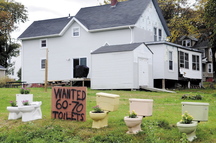 David Labbe is looking for 60 to 70 toilets, in addition to the five already there, to install on his lawn in Augusta to protest the city’s decision to deny a zoning change that would have permitted Dunkin’ Donuts to build a store on the property.