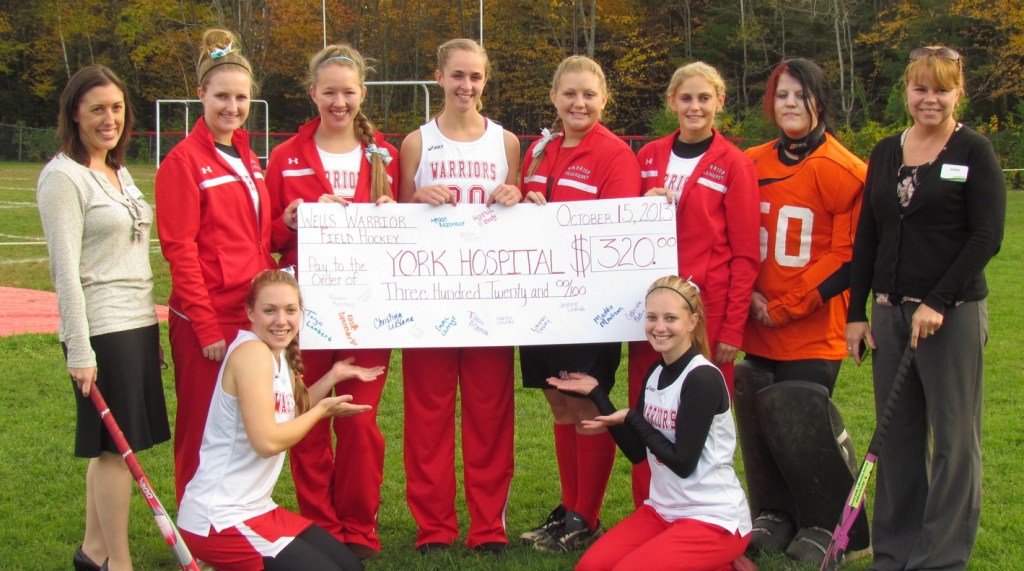 Members of the Wells High School field hockey team recently presented a check in the amount of $320 to Dr. Amanda Demetri Lewis, D.O., of York Hospital, left. With her, standing from left, are players Jasmine Loukola, Gabi Betters, Liz Bouchard, Randi Albano, Kayla Albano, Paige Barbour and hospital worker Joann Paquette. Sitting are Christina LeBlanc and Kassie Batchelder.