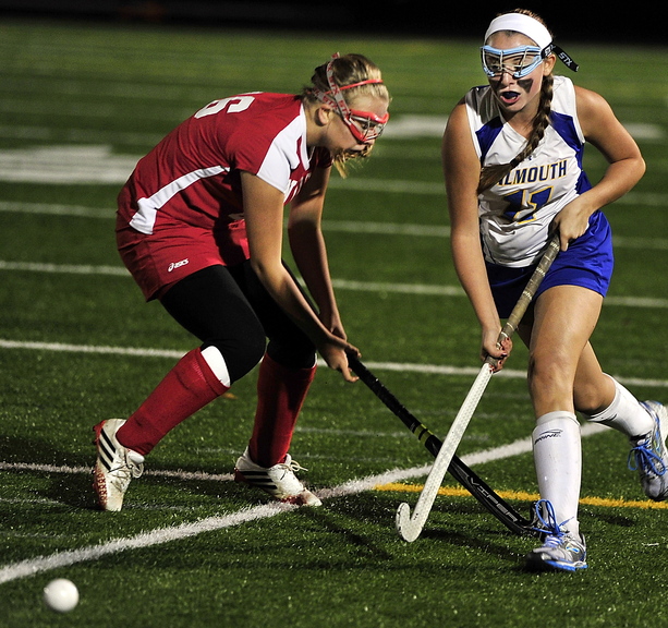 Kate Lannon of Falmouth moves in against Marissa Nance of Sanford during Falmouth’s 4-0 victory Wednesday night in a Western Class A field hockey quarterfinal.