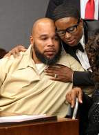 Gerard Richardson is hugged by his sister, Yvette Green, after a hearing in Somerville, N.J., Monday, where a judge overturned his murder conviction and ordered him released.