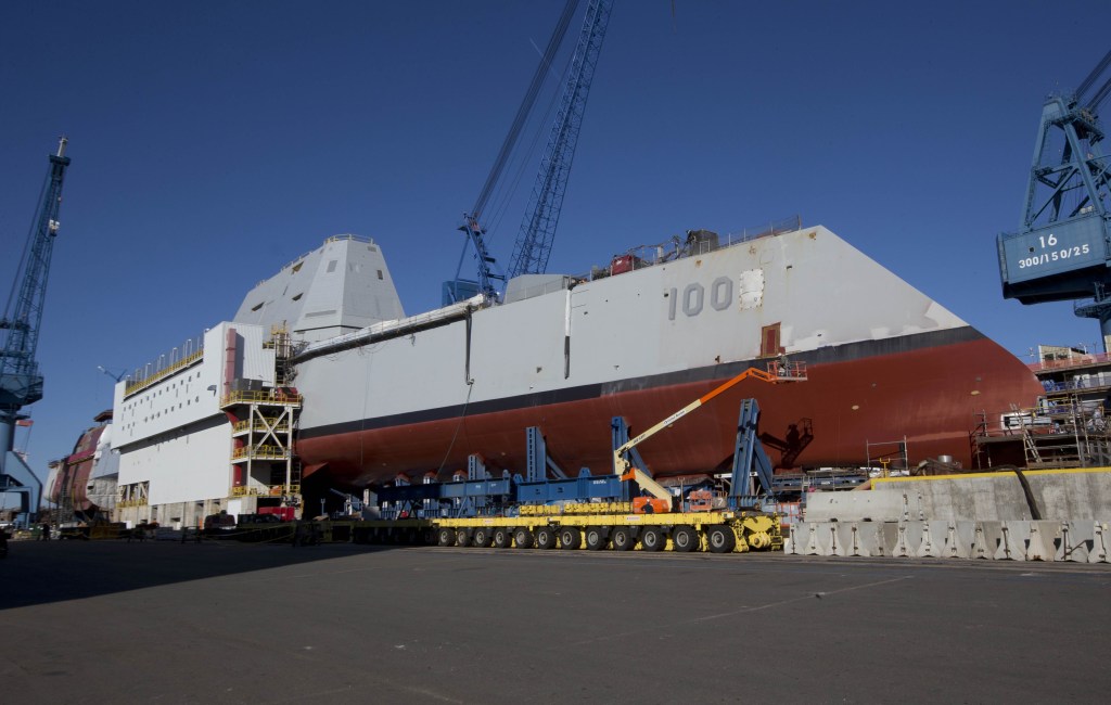 The first-in-class Zumwalt, the largest U.S. Navy destroyer ever built, is seen at Bath Iron Works. The christening of the Zumwalt was canceled once because of the government shutdown, but plans call for the ship to be moved to dry dock and floated without fanfare in the coming days.