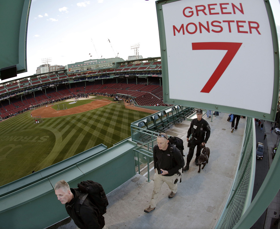 Security personnel perform a sweep of Fenway Park before Game 2 of the World Series. Game 6 presents a tougher task, because a Boston win will set off an exuberant celebration.