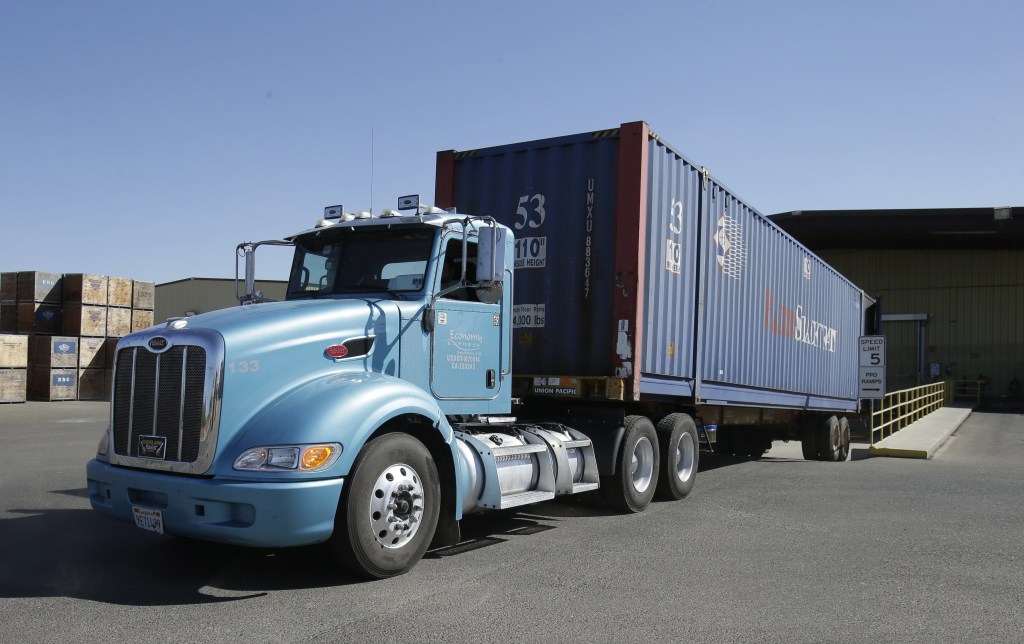 A truck loaded with almonds leaves the Hughson Nut, Inc., in Livingston, Calif., last month. The company was robbed twice by thieves pretending to be legitimate truck drivers.
