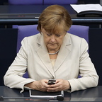In this photo from June, German Chancellor Angela Merkel uses her cellphone at the German Federal Parliament Bundestag.