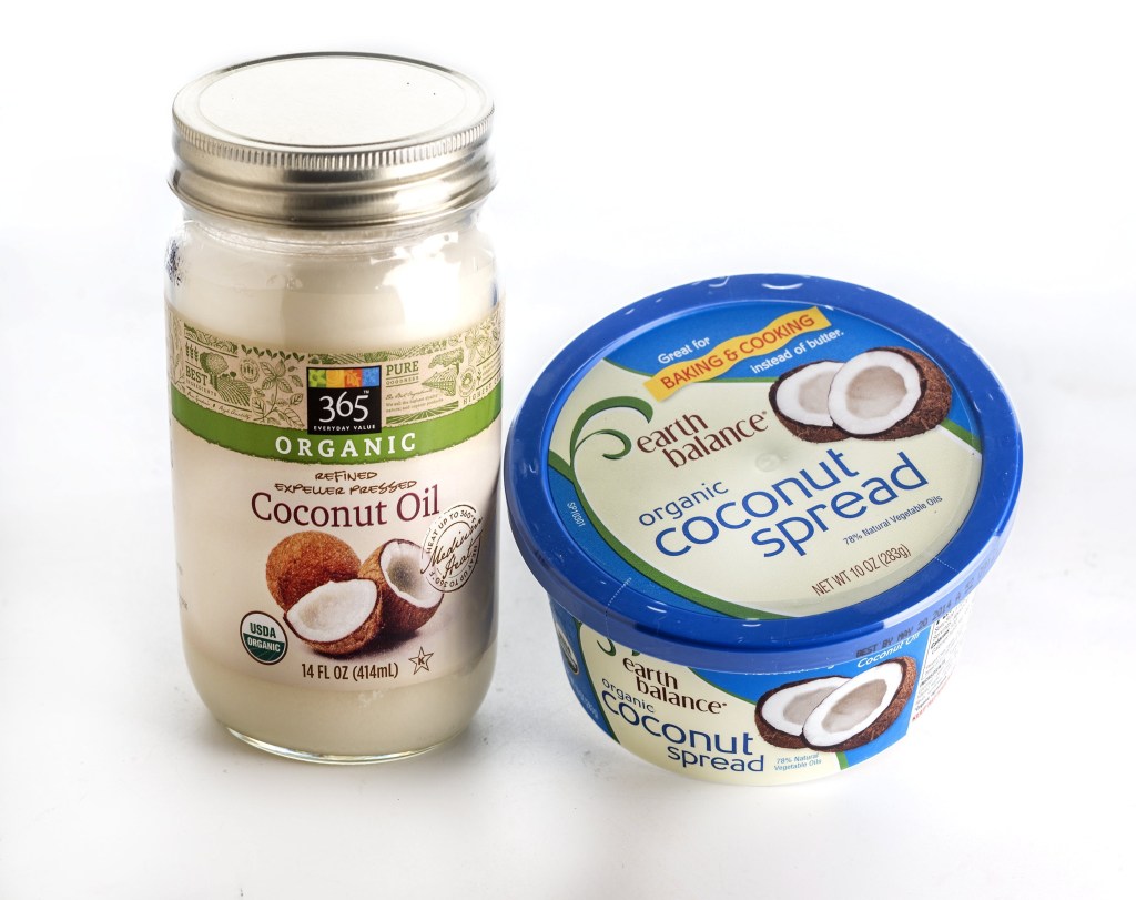 Coconut meat is pressed to produce coconut oil, which is good for frying, sauteing; Coconut spreads use coconut oil as the primary ingredient and may contain other oils.