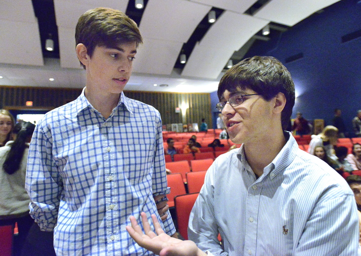 Government students Tim Hartel and Brian Nestor, both seniors, share their thoughts after the Maine Supreme Judicial Court heard oral arguments of several cases at Cape Elizabeth High School.