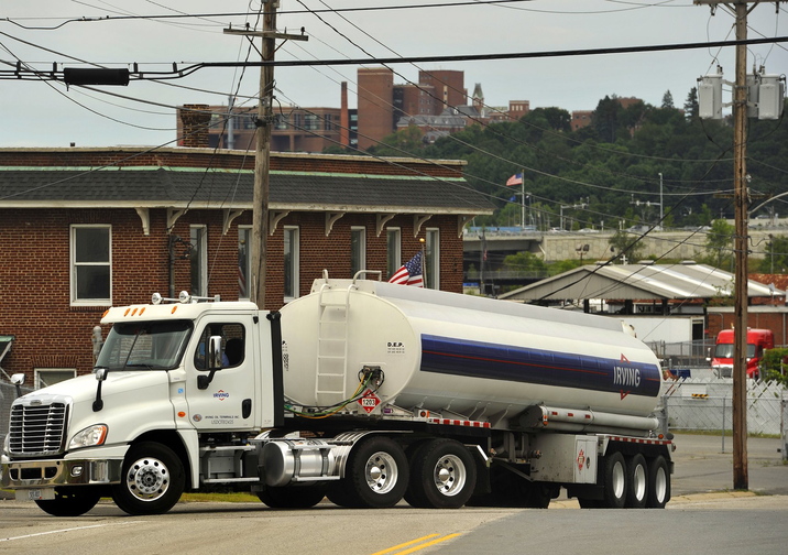 2013 Press Herald File Photo/John Ewing Oil trucks load and unload at terminal facilities in South Portland in July 25. Heating oil prices are expected to be down slightly this winter, but could still be the second-highest average on record.