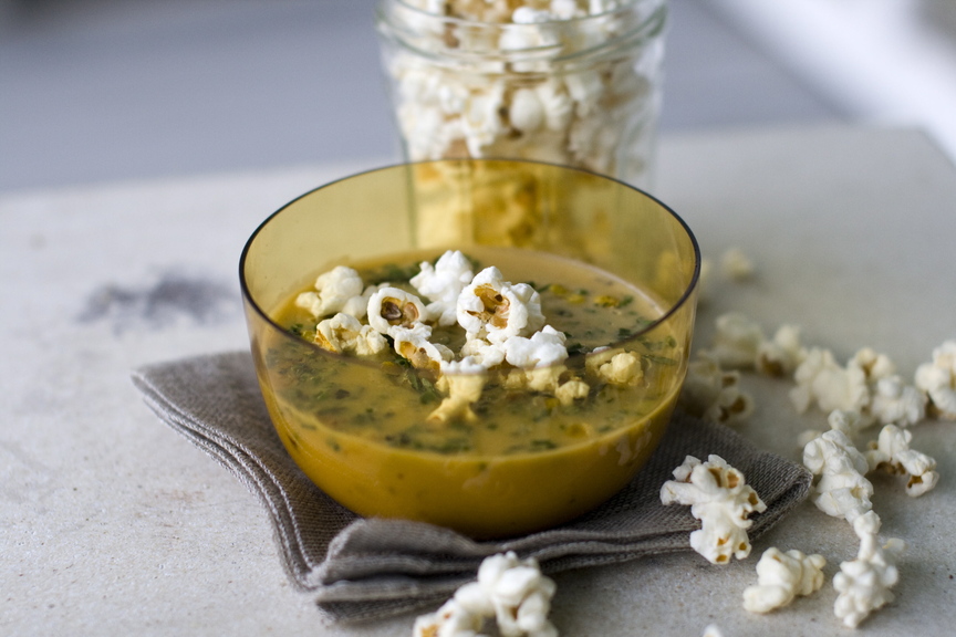 Top caramelized onion and squash bisque with popcorn or other tasty options.