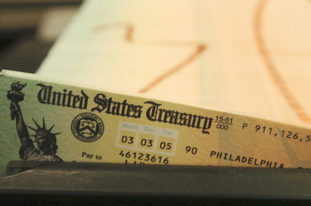 2005 Associated Press File Photo Trays of printed social security checks wait to be mailed from the U.S. Treasury’s Financial Management services facility in Philadelphia. Millions of Social Security recipients can expect a historically small increase in benefits come January 2014.
