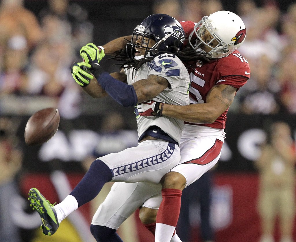 Seattle Seahawks cornerback Richard Sherman, 25, breaks up a pass intended for Arizona Cardinals wide receiver Michael Floyd in the first half Thursday at Glendale, Ariz.
