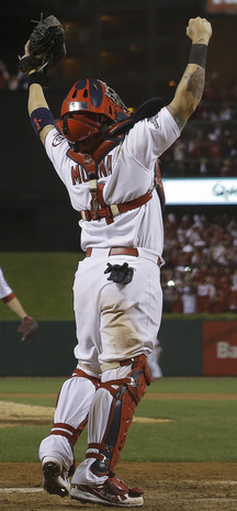 Cardinals catcher Yadier Molina celebrates Friday night after St. Louis wrapped up the National League Championship Series with a 9-0 victory over the Dodgers, earning a trip to the World Series for the 19th time in franchise history.
