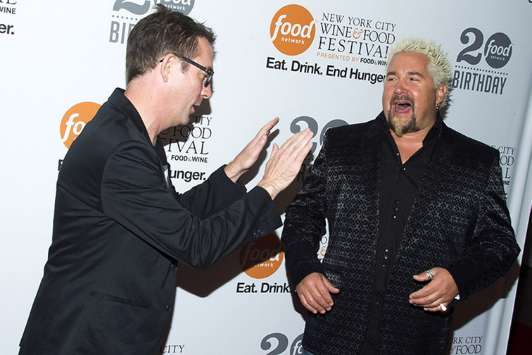 Ted Allen, left, and Guy Fieri attend the Food Network’s 20th birthday party on Thursday, Oct. 17, in New York City.