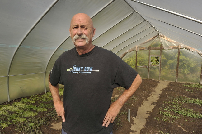John Ewing/staff photographer... October 3, 2013…Paul Lorrain, who owns and operates Sunset Farm Organics in Lyman, is concerned about what unexpected impacts the furlough might have on his businesses. Lorrain, who is a member at large on the MOFGA Board of Directors, grows winter greens in his greenhouses for local restaurants in the Portland area.