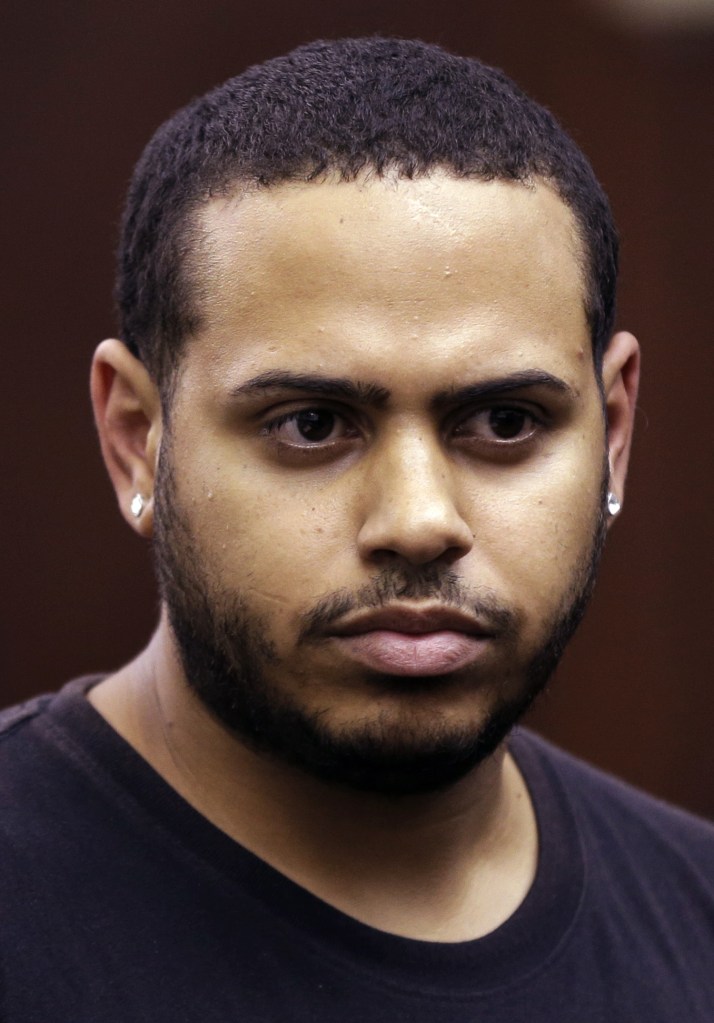 Christopher Cruz appears in criminal court in New York, Wednesday. Cruz was charged Wednesday with reckless driving after prosecutors said he touched off a tense encounter with the driver of an SUV and a throng of other bikers.