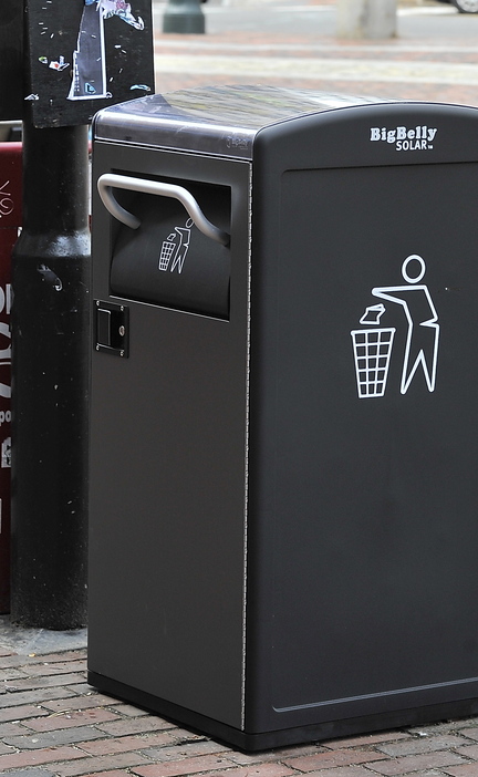 A new Big Belly Solar trash-compacting bin stands in Portland’s Monument Square.