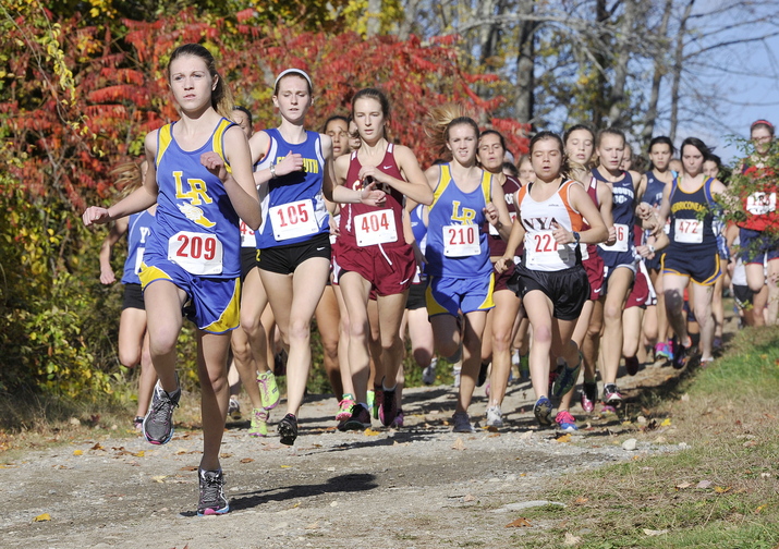 Audrey Blais of Lake Region leads the pack near the start of the girls’ race Friday at the Western Maine Conference cross country championships held at St. Joseph’s College in Standish.