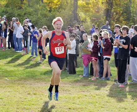 Will Shafer of Gray-New Gloucester shows his excitement as he approaches the finish line to win the boys’ race in a time of 16:26.