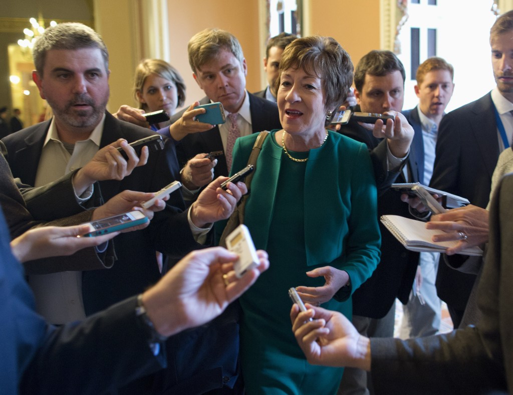 Sen. Susan Collins, R-Maine, talks with reporters after arriving on Capitol Hill following a meeting between Republican senators and the president.