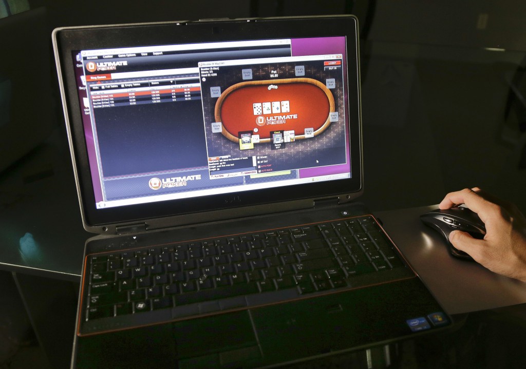 A sample poker game is played on the Ultimate Gaming website in Las Vegas. Ultimate Gaming began offering Internet gambling in Nevada earlier this year, and now New Jersey residents and visitors will be able to start gambling online on Nov. 26.