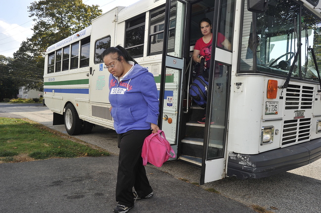 Sheena Patel, 27, is dropped off at her South Portland home last week after her day at a rehabilitation facility. Her father, Glen Herbert, doesn't trust CTS to coordinate Patel's rides.