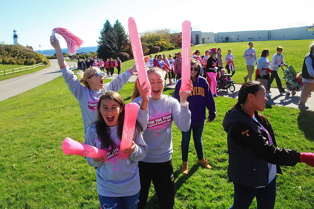 Cheverus High School students, from left, Hannah Tyson, Emily Turner, Kate Gordon, and Ally Smith join others in cheering on breast cancer survivors, family and friends.