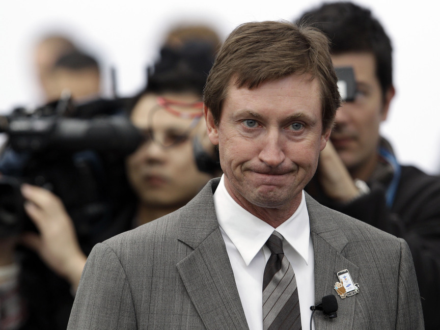 This is a Feb. 10, 2010 file photo showing hockey great Wayne Gretzky during an event at the Olympic Games in Vancouver, British Columbia. Two new statues of Gretzky have been vandalized in his hometown. Police in Brantford, Ontario, say they are studying a videotape sent to them of Monday’s, Sept. 30, 2013, overnight vandalism, which involved defacing the statues with spray paint.