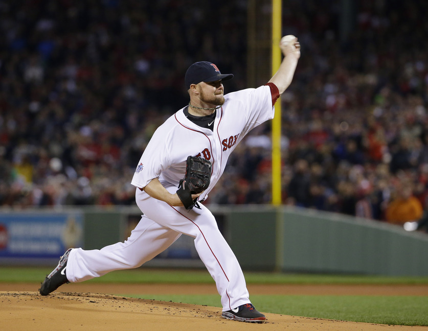 Boston Red Sox starting pitcher Jon Lester throws during the first inning of Game 1 of the World Series Wednesday in Boston.