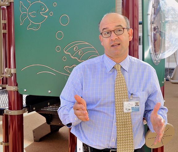 Dr. Matthew Siegel of Spring Harbor Hospital discusses the grant his group received to study autism Thursday, at the new playground designed for autistic and developmentally challenged children.
