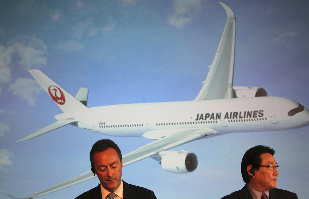Airbus Japan Chief Executive Fabrice Bregier, left, and Japan Airlines President Yoshiharu Ueki attend a news conference in Tokyo on Monday. Japan Airlines is buying 31 planes from Airbus rather than from rival Boeing.