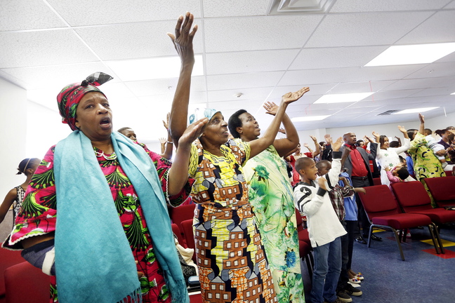 Members of the International Christian Fellowship worship at the church’s new location in Westbrook. The community group has expanded since its beginning 12 years ago on Munjoy Hill and needed a larger space.